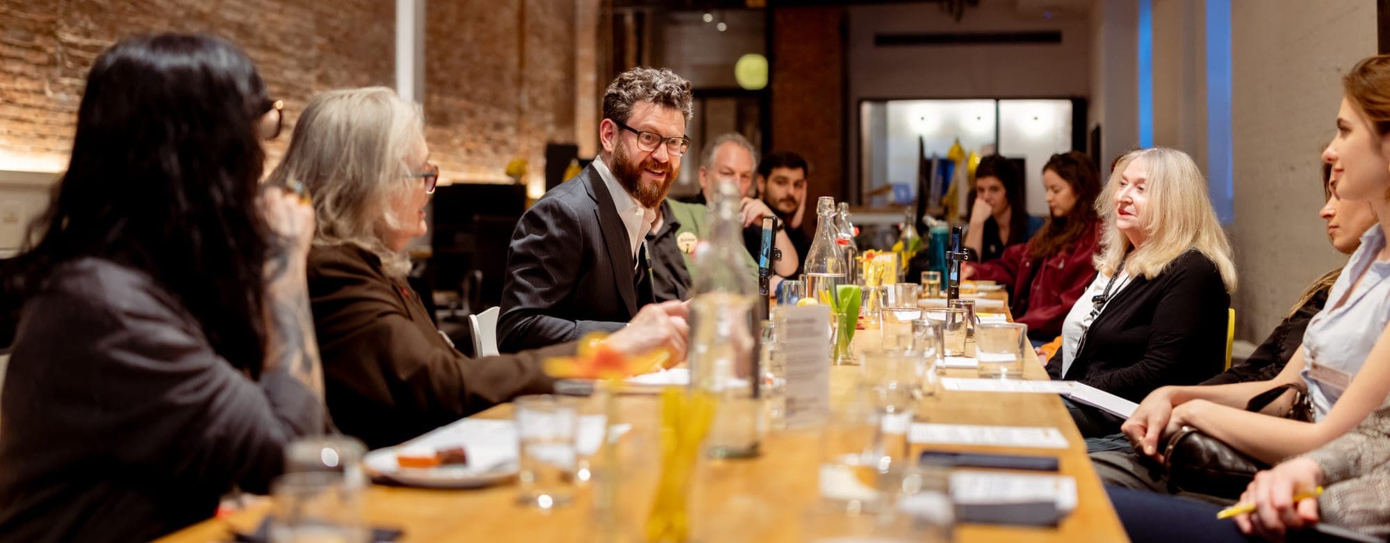 Guests gathered for a Tête-à-Tech fireside chat at the Macktez loft